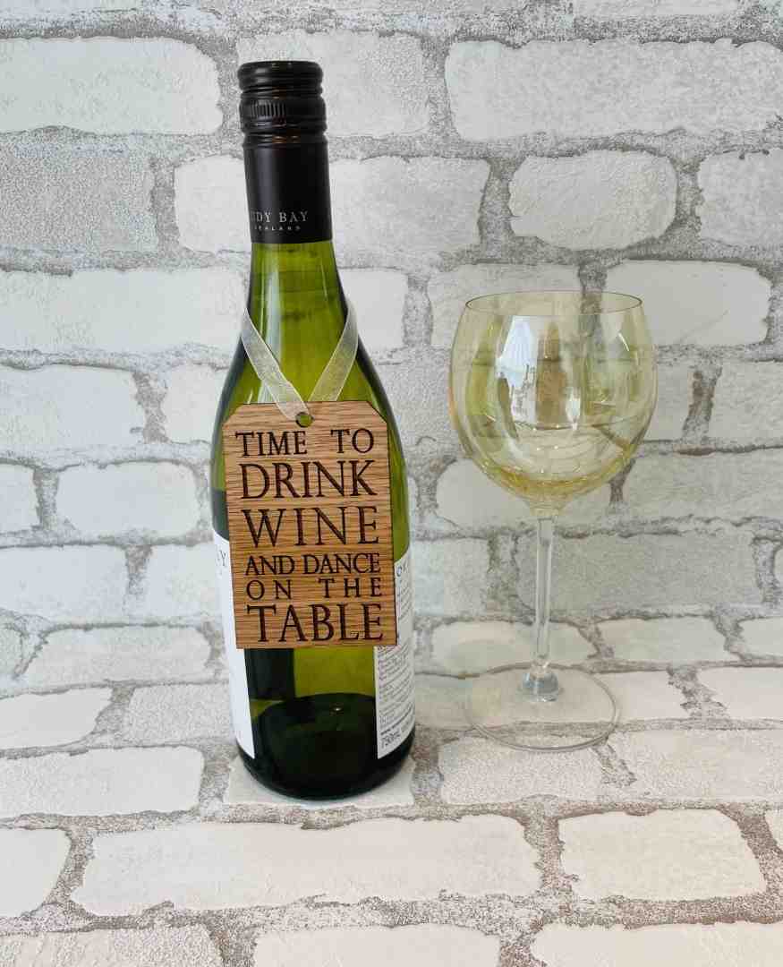 Wooden Bottle Tag/Decoration - Time to Dance on table